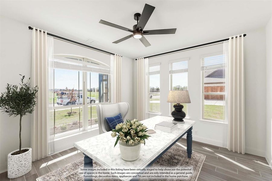 Bright sitting room with large windows, ceiling fan, hardwood floors, and marble coffee table Bright sitting room with large windows, ceiling fan, hardwood floors, and marble coffee table