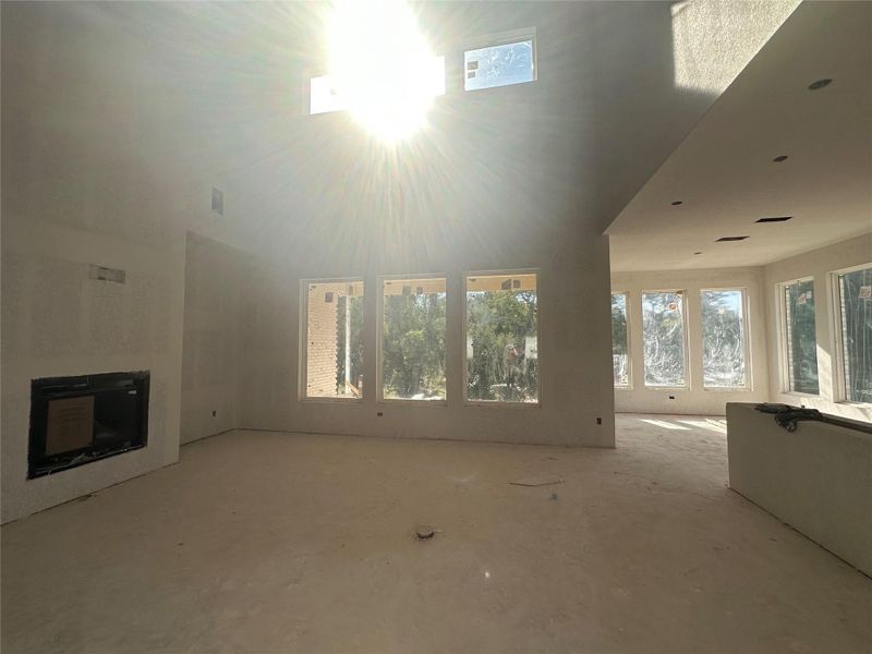 Light & Bright Open Concept Floorplan - Kitchen, Casual Dining & Family Room with soaring ceiling and fireplace