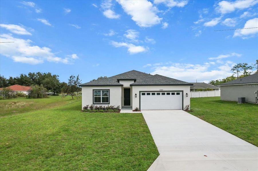 Front exterior of a new home in , Ocala, FL, highlighting curb appeal (Image 26).