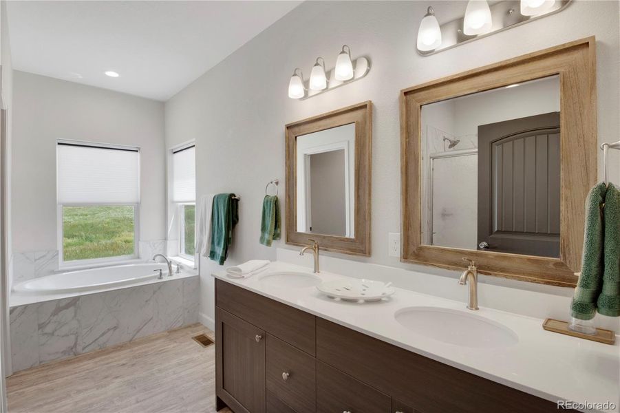 Bedroom with light carpet and a ceiling fan