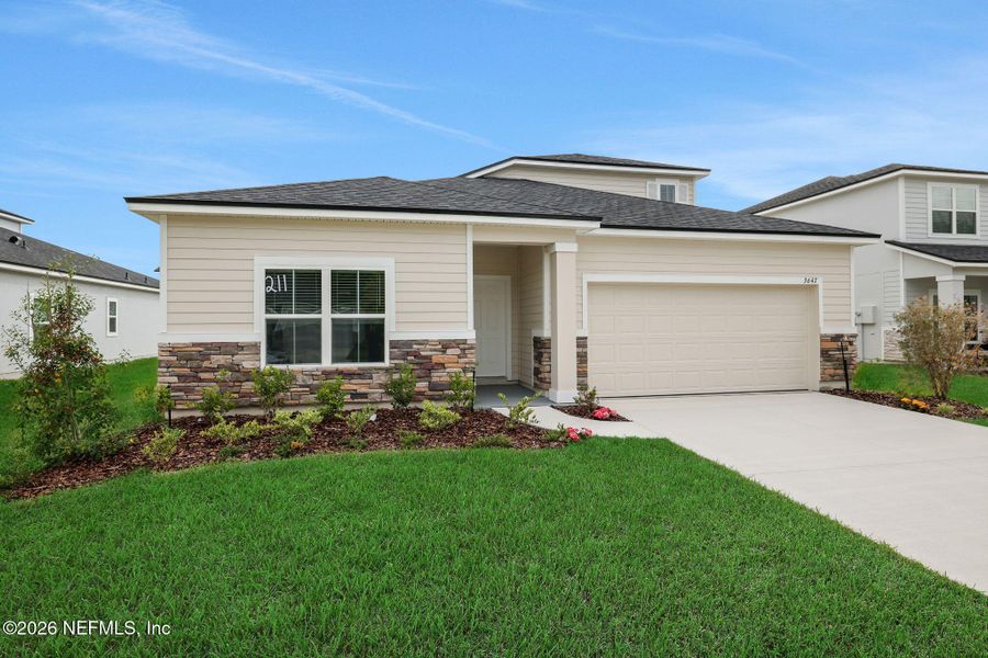Front exterior of a new home in Wilford Oaks, Orange Park, FL, highlighting curb appeal (Image 23).