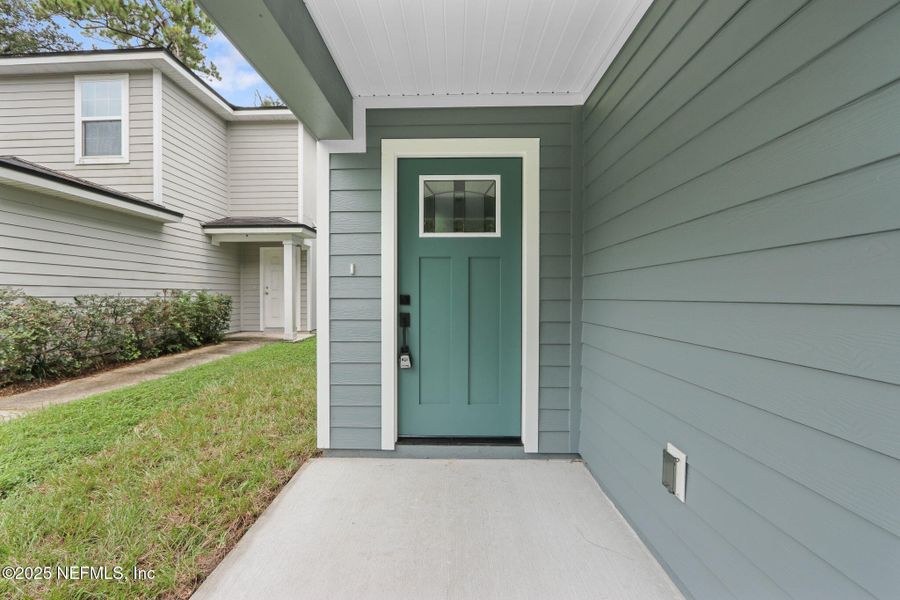 Front exterior of a new home in , Jacksonville, FL, highlighting curb appeal (Image 16).