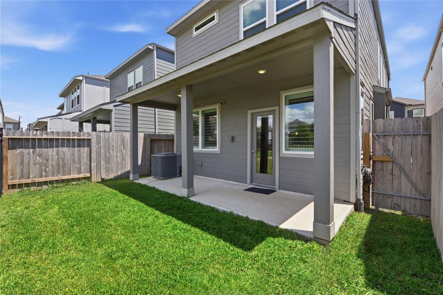 Exterior details and patio area of a home in Dunvale Village - Townhome Collection, Houston (Image 3).