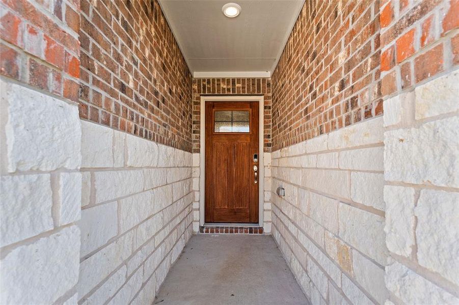 Exterior details and patio area of a home in River Ridge, Crandall (Image 16).