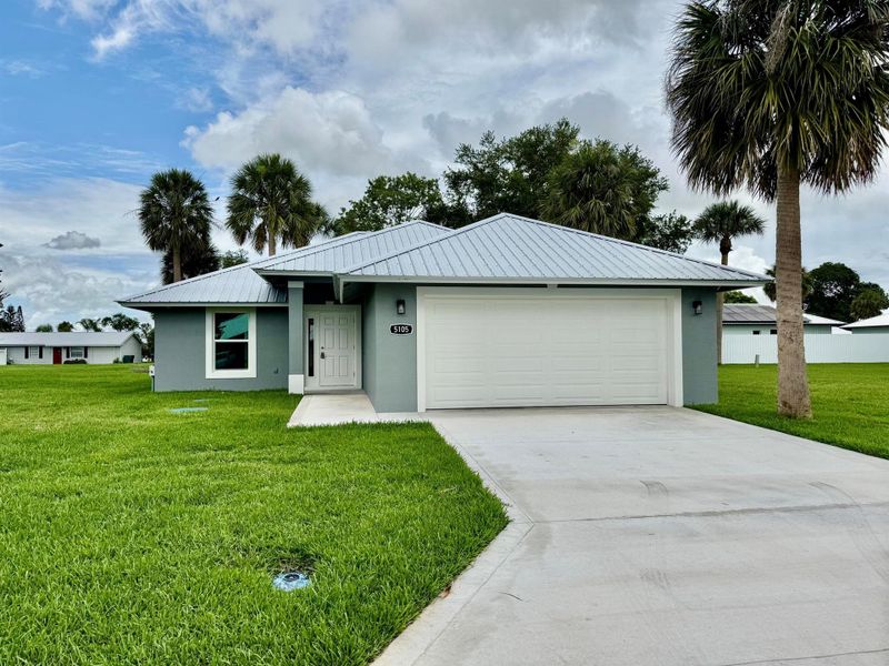 Front exterior of a new home in , Okeechobee, FL, highlighting curb appeal (Image 16).