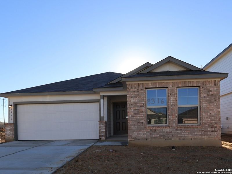 Front exterior of a new home in Agave, San Antonio, TX, highlighting curb appeal (Image 23). Front exterior of a new home in Agave, San Antonio, TX, highlighting curb appeal (Image 23).