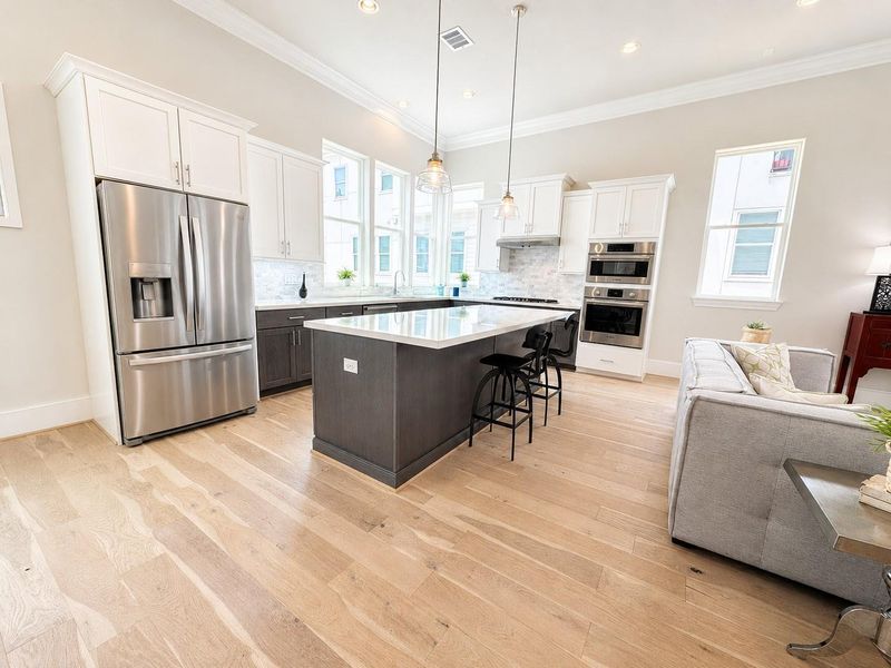 This bright kitchen is perfect for entertaining.   Image has been digitally enhanced.