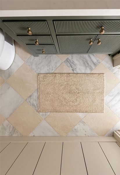 Hall bath has beautiful marble tile flooring Hall bath has beautiful marble tile flooring