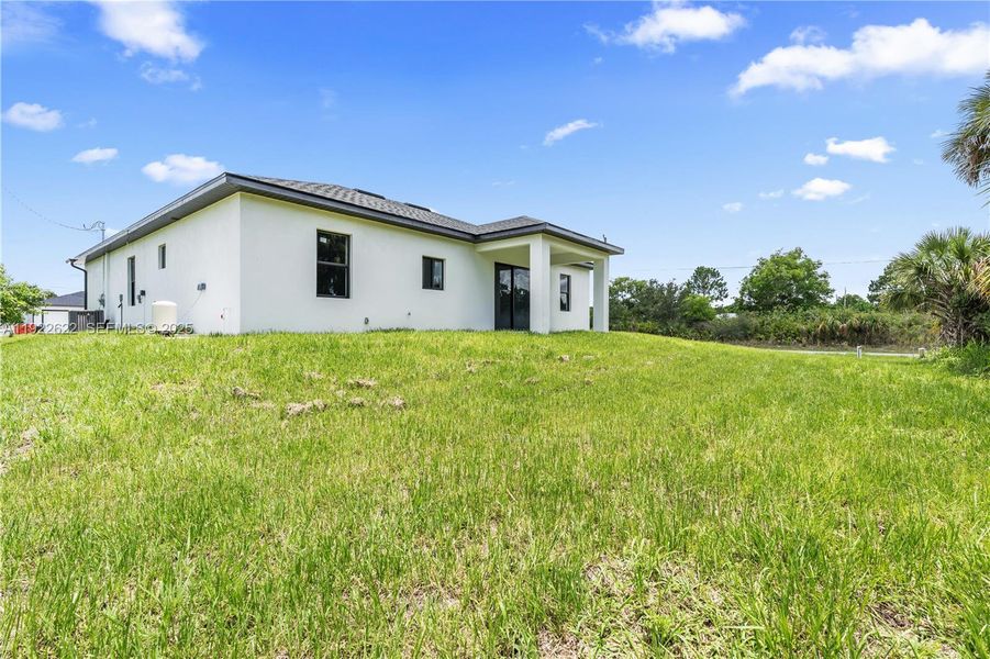 Exterior details and patio area of a home in , Lehigh Acres (Image 24).