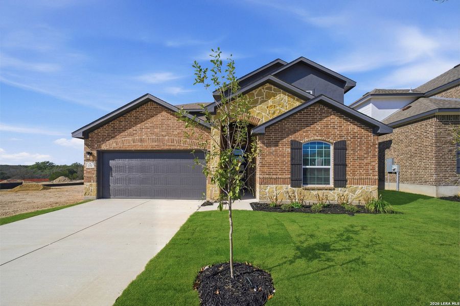 Front exterior of a new home in The Woodlands at Medina Hills, Mico, TX, highlighting curb appeal (Image 24).