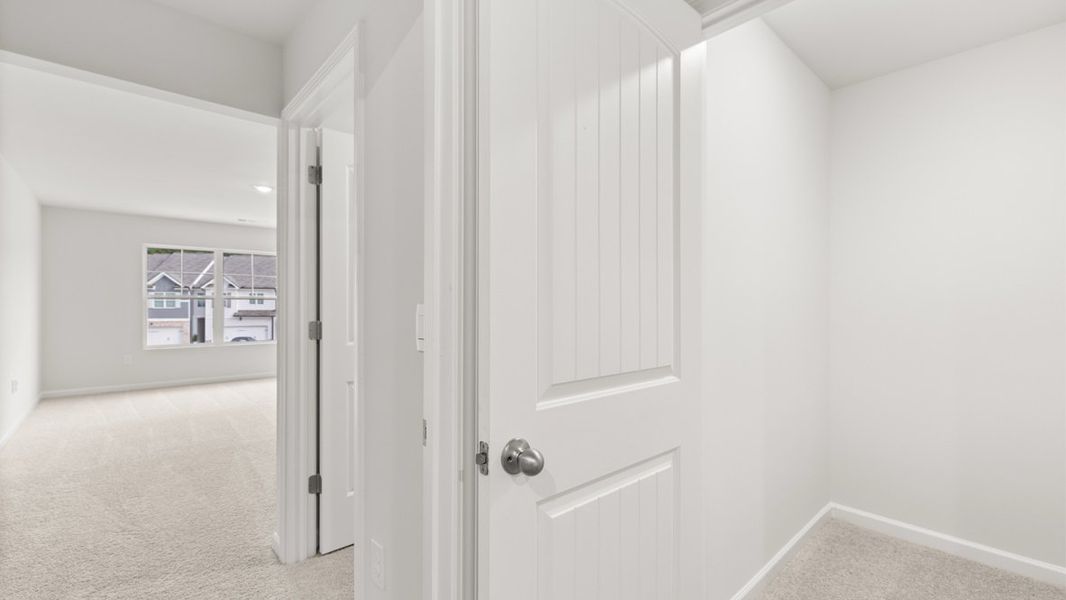 Representative unfurnished interior of a home built from the Salisbury by D.R. Horton in Waypoint, Flowery Branch (Image 19).