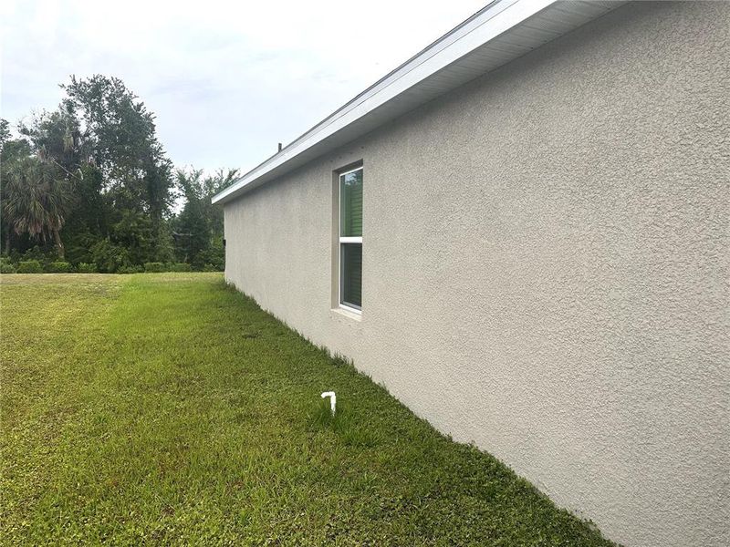 Exterior details and patio area of a home in Silverstone North, Palmetto (Image 28).