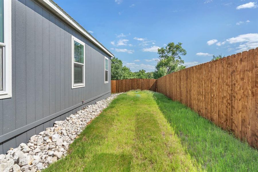 Exterior details and patio area of a home in , Granbury (Image 22).