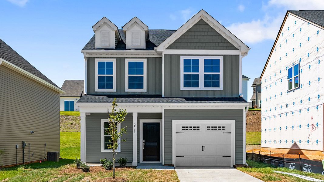 Front exterior of a new home in Hanes Lake, Winston-Salem, NC, highlighting curb appeal (Image 1). Front exterior of a new home in Hanes Lake, Winston-Salem, NC, highlighting curb appeal (Image 1).