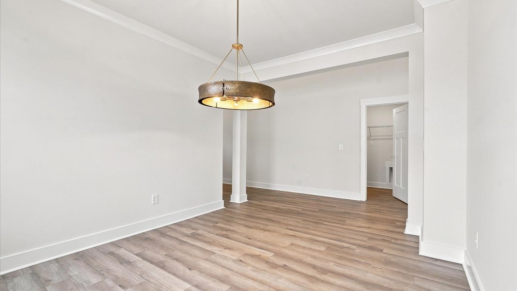 Notable dining room with high standards and elegant millwork in this accomplished home by DRB Homes