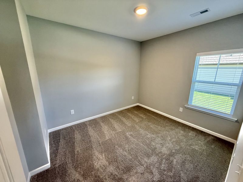 Spacious, unfurnished interior of a new home in Stone Fort Meadows, Manchester (Image 10).