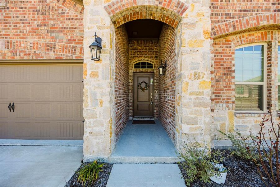 Entrance to property featuring a garage