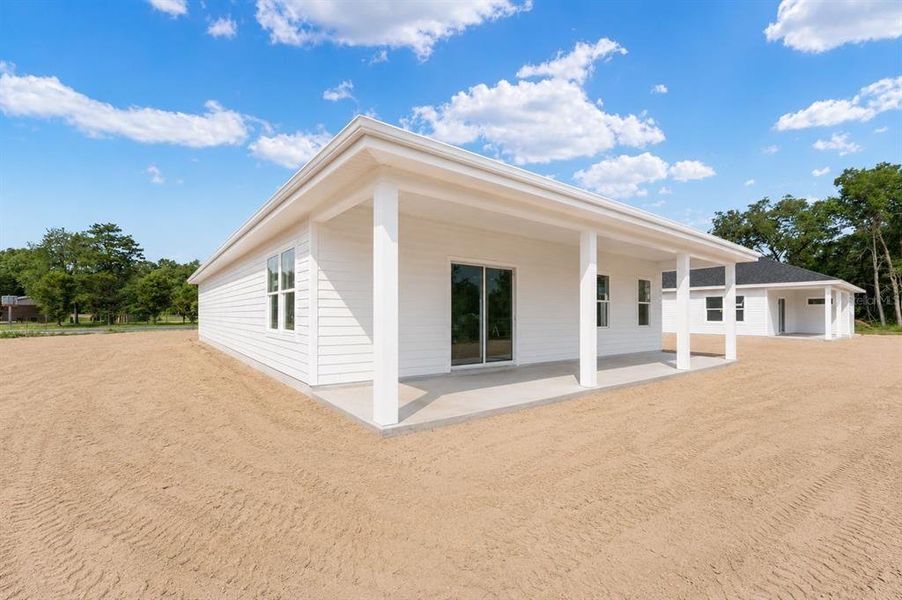 Exterior details and patio area of a home in , Williston (Image 3).