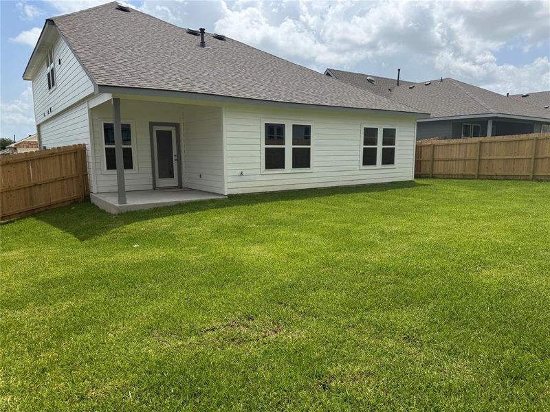 Front exterior of a new home in Liberty Village, Brenham, TX, highlighting curb appeal (Image 8).