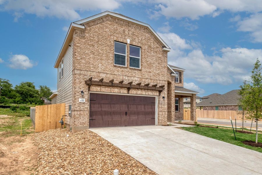 Front exterior of a new home in River Bluff, Leander, TX, highlighting curb appeal (Image 1). Front exterior of a new home in River Bluff, Leander, TX, highlighting curb appeal (Image 1).