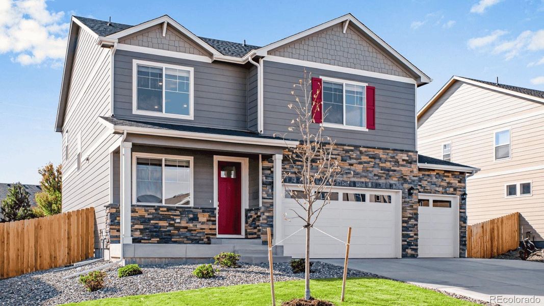 Front exterior of a new home in Trails at Crowfoot, Parker, CO, highlighting curb appeal (Image 1).