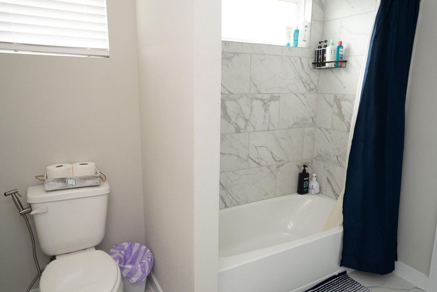 Furnished interior view inside a new home in Sunterra, Katy (Image 8).