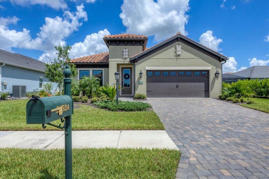 Front exterior of a new home in , Englewood, FL, highlighting curb appeal (Image 27).