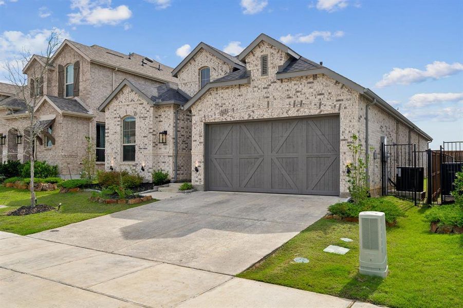 Front exterior of a new home in Cottages of Celina, Celina, TX, highlighting curb appeal (Image 21). Front exterior of a new home in Cottages of Celina, Celina, TX, highlighting curb appeal (Image 21).