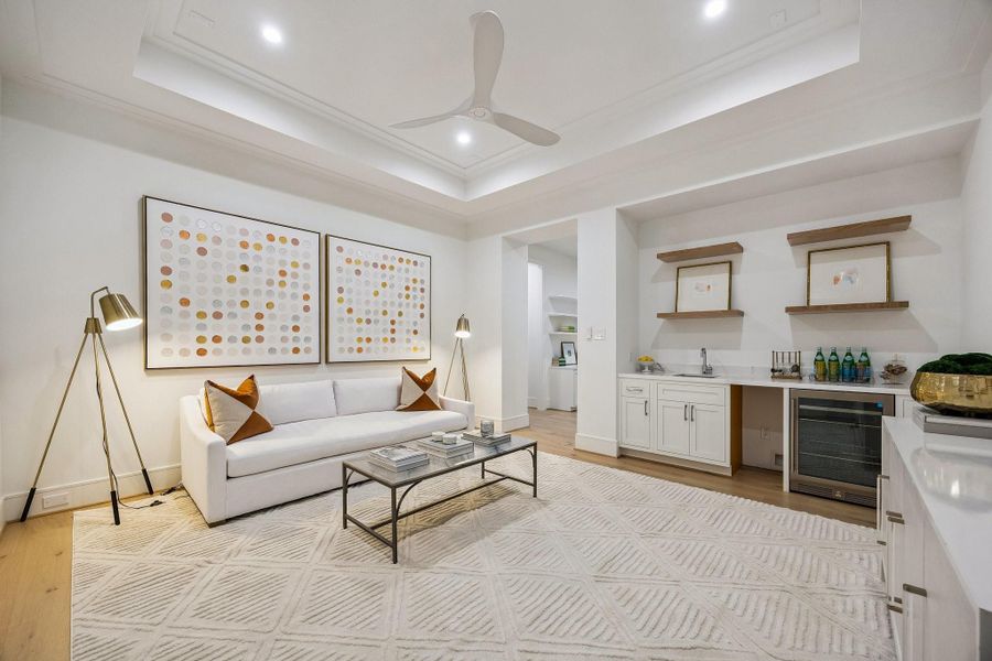 Upstairs media room with 7 1/2 Inch Wide Plank, European White Oak Floors, Coffered Ceiling and a MinkaAire Roto XL 60" 3 Blade Ceiling Fan.
