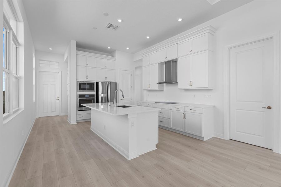 Furnished interior view inside a new home in PGA Village Verano, Port St. Lucie (Image 10).