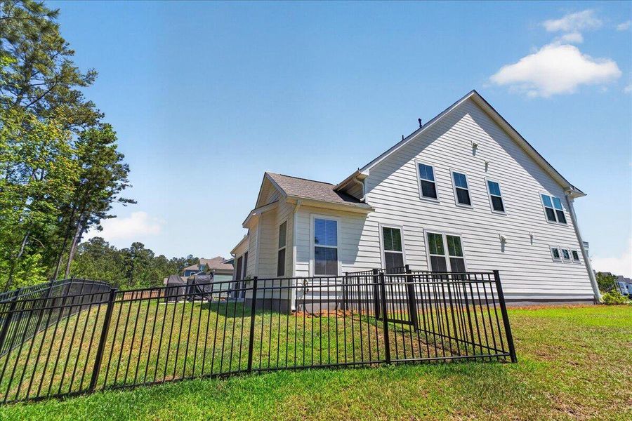 Exterior details and patio area of a home in Tidewater at Lakes of Cane Bay, Summerville (Image 23).