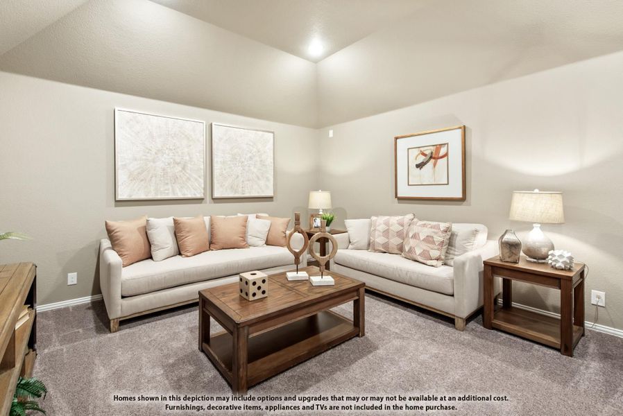 Living room with two beige sofas, wood coffee table, carpet flooring, and vaulted ceiling