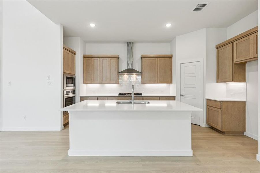 Kitchen in the Da Vinci II home plan by Trophy Signature Homes – REPRESENTATIVE PHOTO