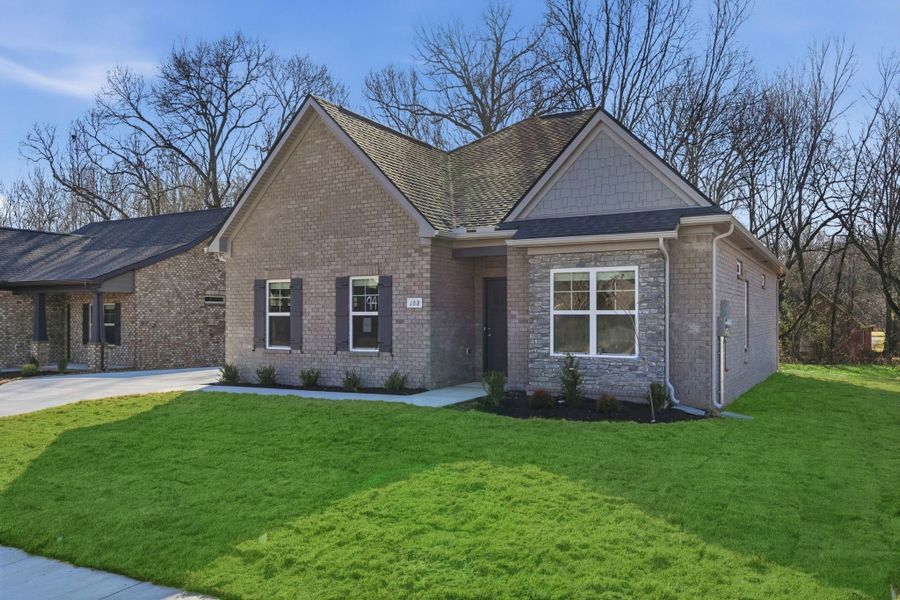 Front exterior of a new home in Sagewood, Tullahoma, TN, highlighting curb appeal (Image 22).