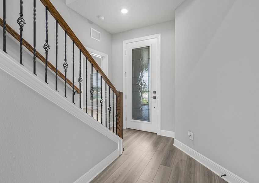 The entryway is highlighted by this gorgeous front door!