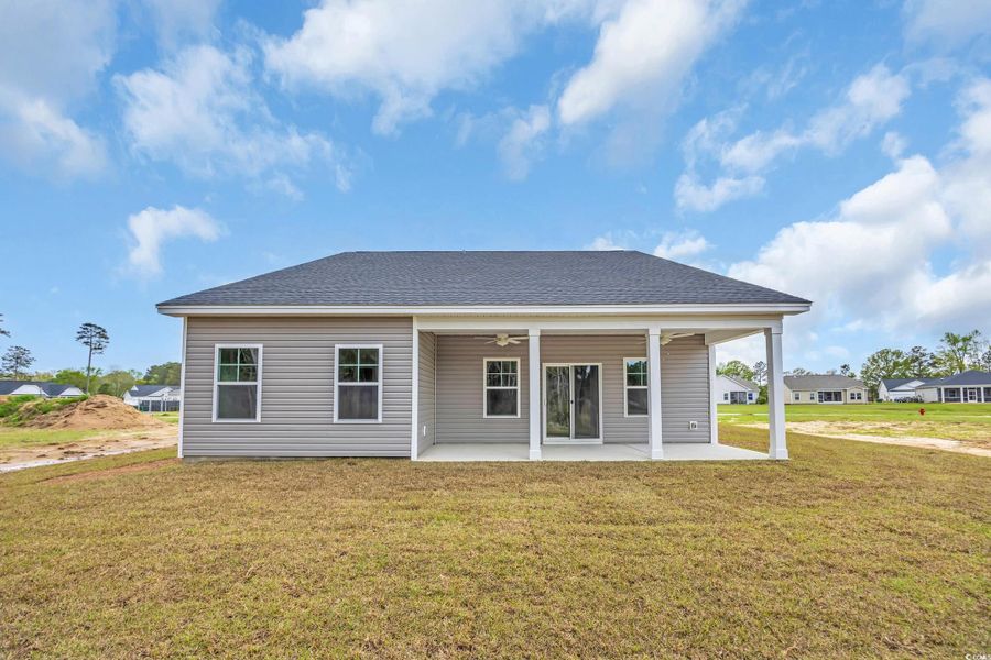 Back of house with a yard, ceiling fan, a patio, and a shingled roof Back of house with a yard, ceiling fan, a patio, and a shingled roof