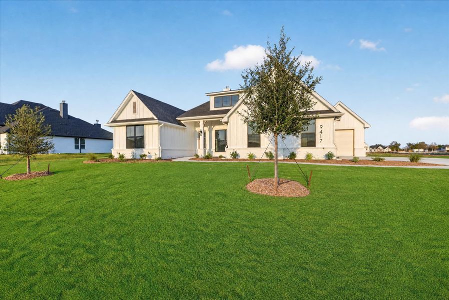 Front exterior of a new home in Paloma Ranches, Justin, TX, highlighting curb appeal (Image 22).