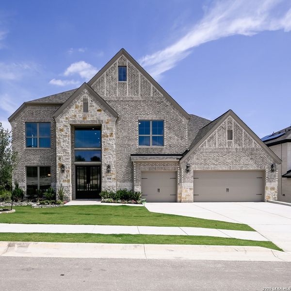 Front exterior of a new home in Johnson Ranch, Bulverde, TX, highlighting curb appeal (Image 2). Front exterior of a new home in Johnson Ranch, Bulverde, TX, highlighting curb appeal (Image 2).