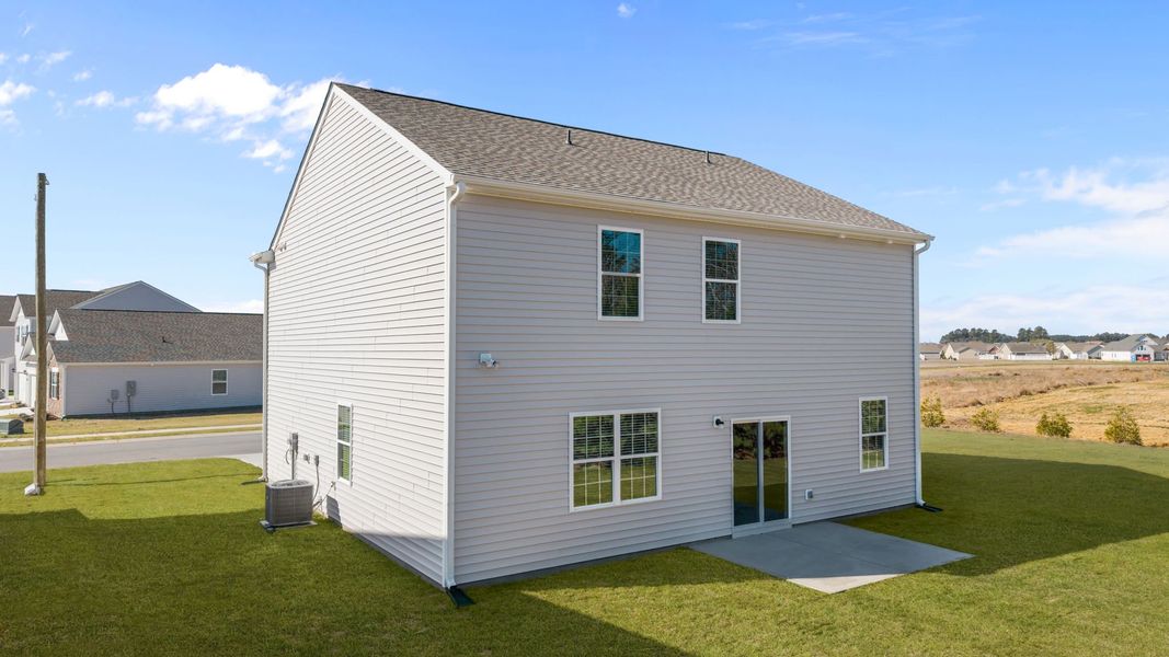 Exterior details and patio area of a home in Ridgewood Farms, Winterville (Image 12).