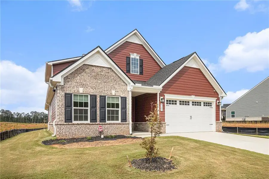 Front exterior of a new home in , McDonough, GA, highlighting curb appeal (Image 1).
