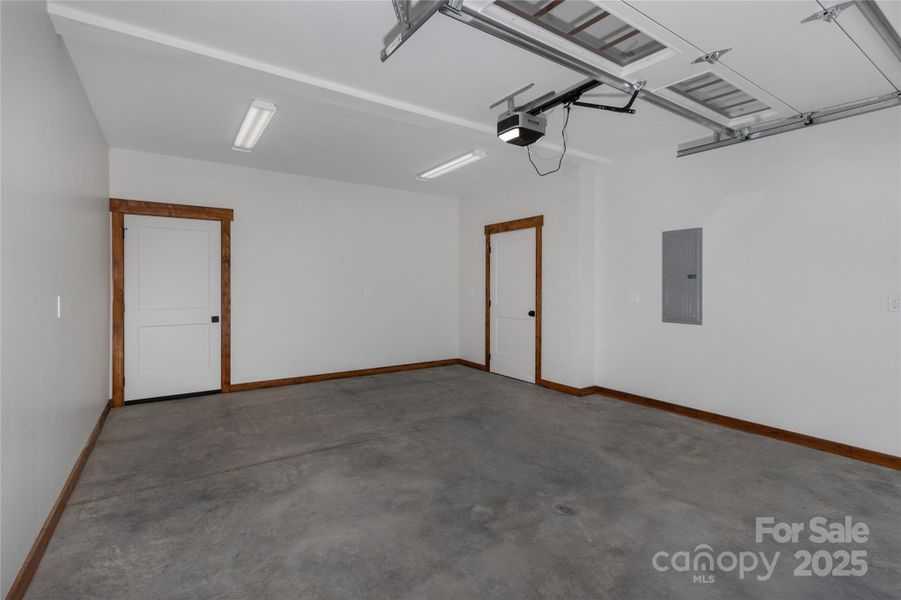 One car garage with service door and storage on basement level