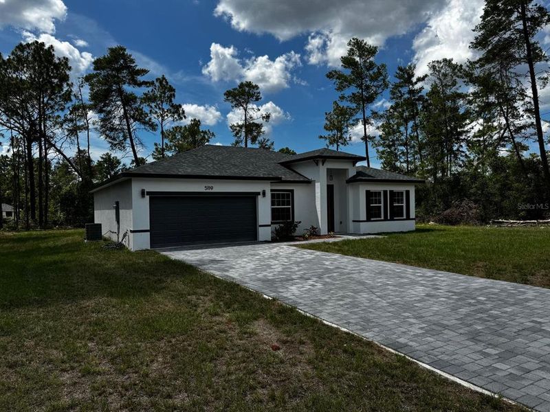 Front exterior of a new home in , Ocala, FL, highlighting curb appeal (Image 2).