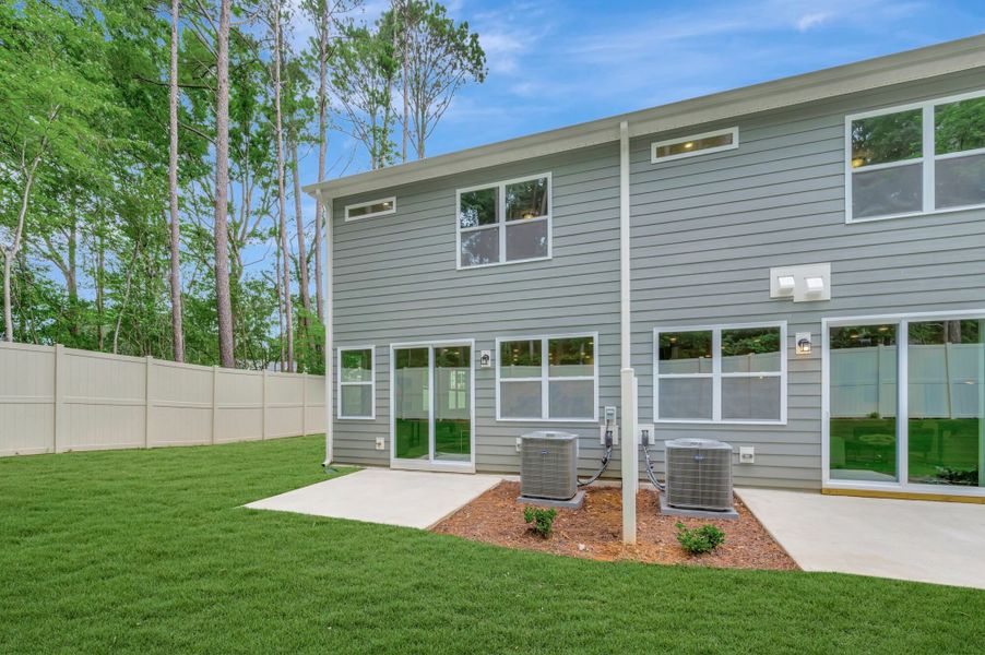 Exterior details and patio area of a home in Ashmore Townes, Garner (Image 20). Exterior details and patio area of a home in Ashmore Townes, Garner (Image 20).