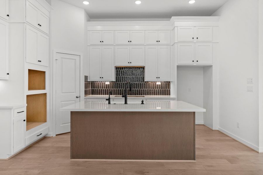 Chef-Inspired Kitchen With Built In Appliances And Elegant Finishes