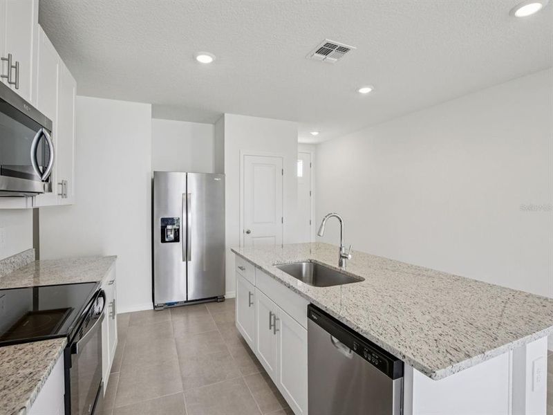 Furnished interior view inside a new home in Magnolia Bay - Premier Series, Nokomis (Image 3).