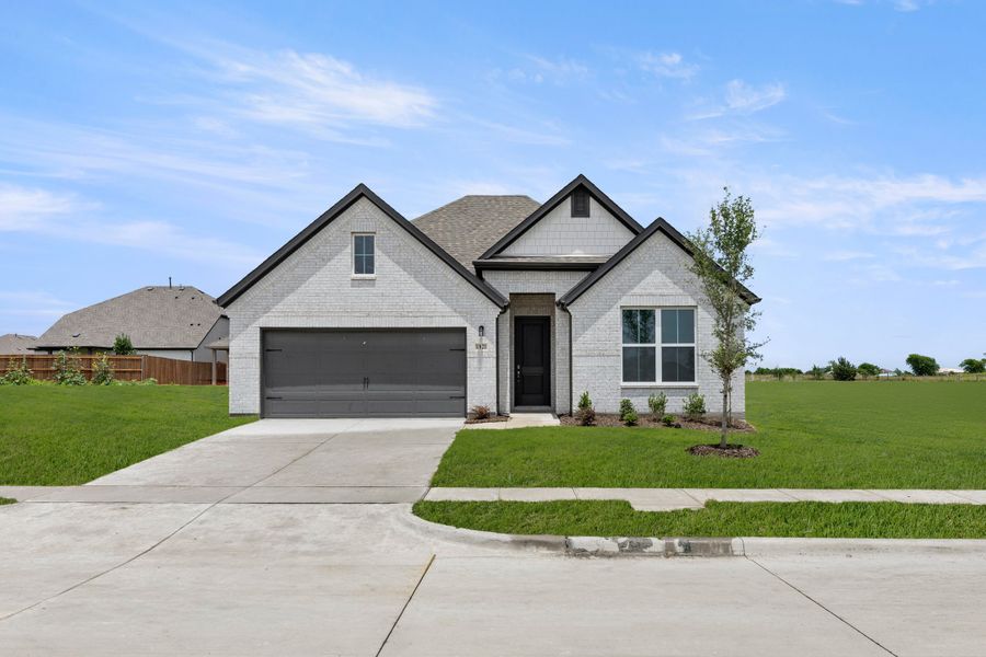 Front exterior of a new home in Walden Pond, Forney, TX, highlighting curb appeal (Image 1). Front exterior of a new home in Walden Pond, Forney, TX, highlighting curb appeal (Image 1).
