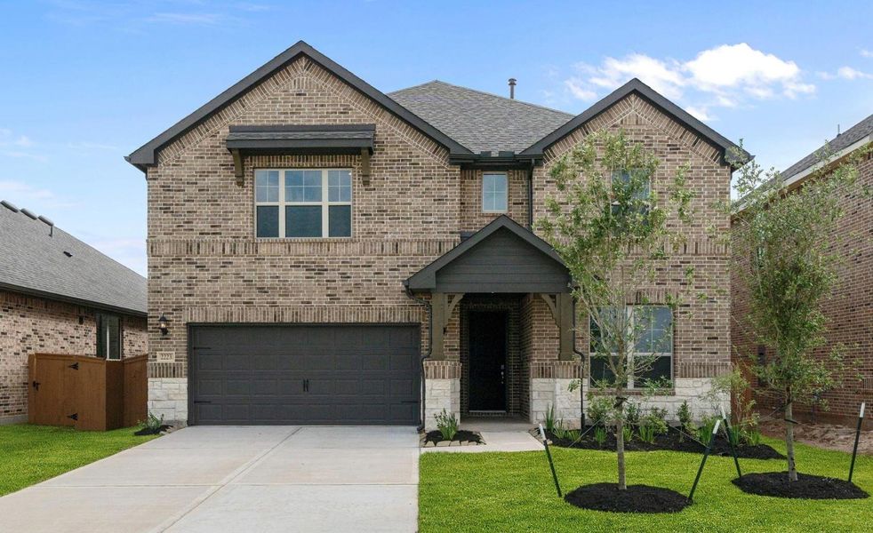 Front exterior of a new home in Sunterra 50s, Katy, TX, highlighting curb appeal (Image 1). Front exterior of a new home in Sunterra 50s, Katy, TX, highlighting curb appeal (Image 1).