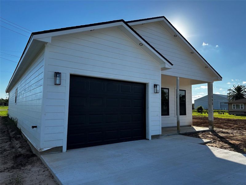 Front exterior of a new home in , Freeport, TX, highlighting curb appeal (Image 17). Front exterior of a new home in , Freeport, TX, highlighting curb appeal (Image 17).