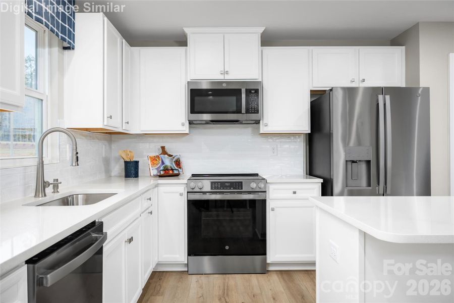 A kitchen that keeps it all close. Time to cook, gather, and make memories.