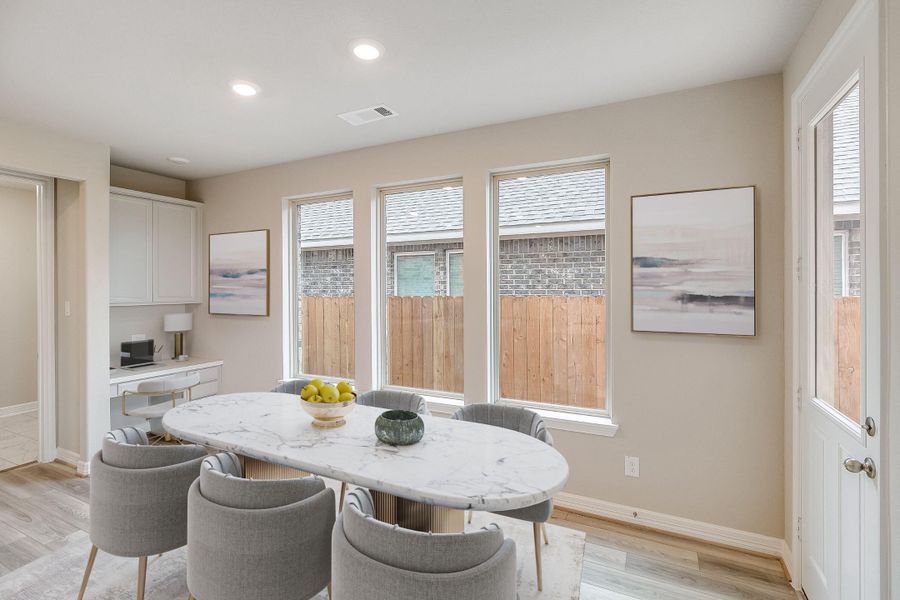 Dining room. Note: Sample product photo - actual exterior and interior selections may vary by homesite